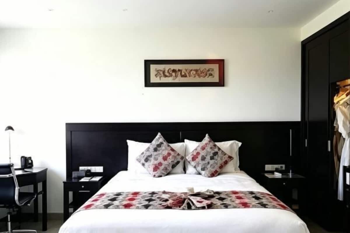 Premium bedding, down duvets, pillow-top beds, in-room safe