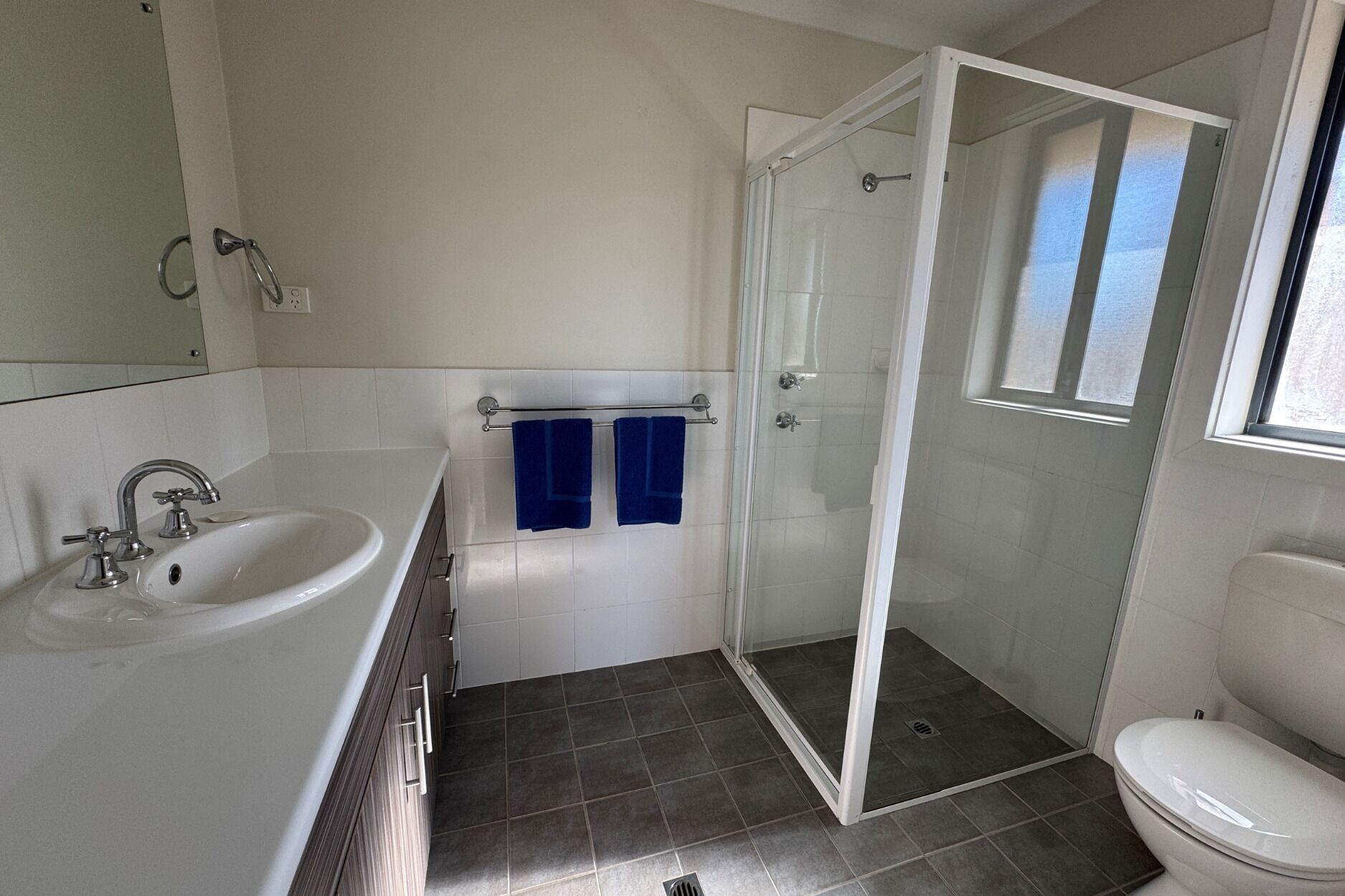 A bathroom with a bathtub, a shower, and a toilet.