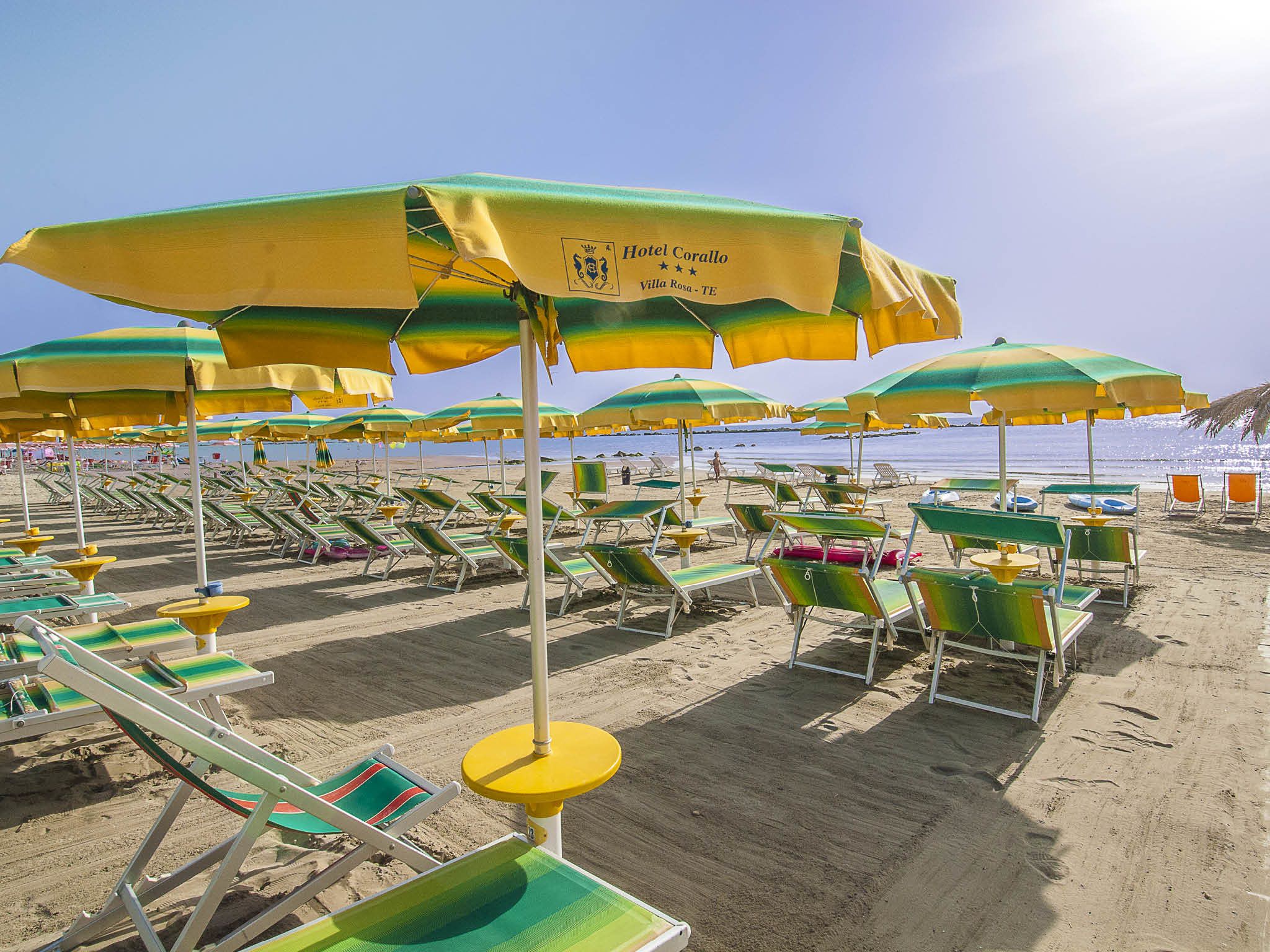 On the beach, sun-loungers, beach umbrellas, beach towels