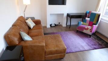 Apartment, 1 Bedroom | Living room | Flat-screen TV