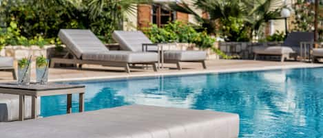Seasonal outdoor pool, pool loungers