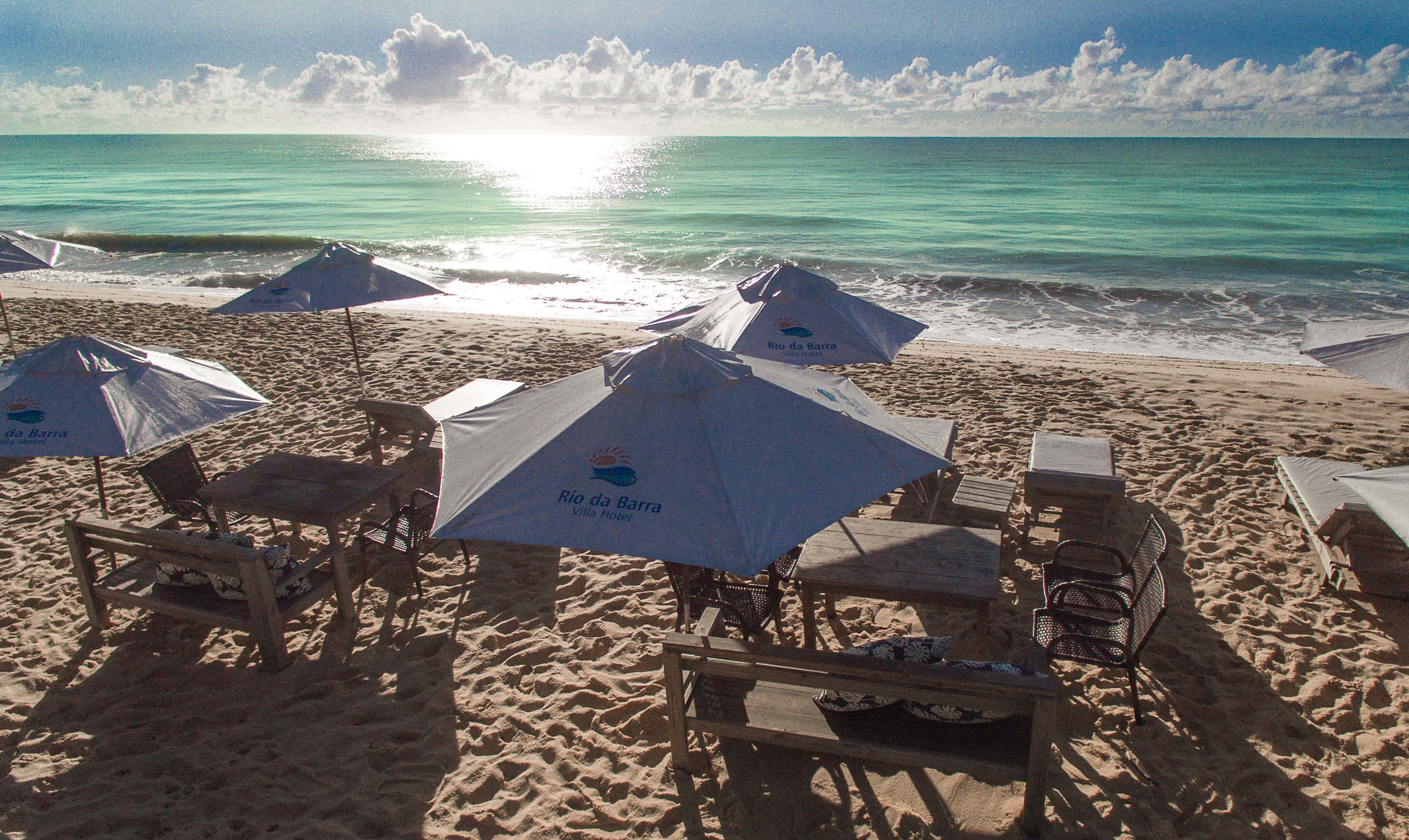 on the beach, sun-loungers, beach umbrellas, beach towels