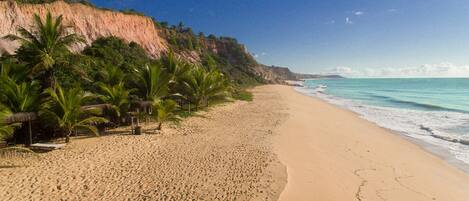 On the beach, sun-loungers, beach umbrellas, beach towels