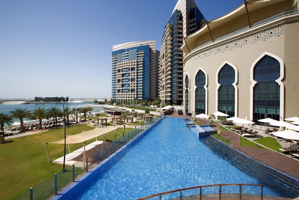 Outdoor pool, pool cabanas (surcharge), pool loungers