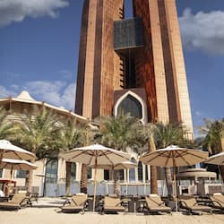 On the beach, white sand, sun-loungers, beach umbrellas