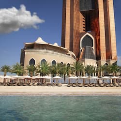 On the beach, white sand, sun-loungers, beach umbrellas