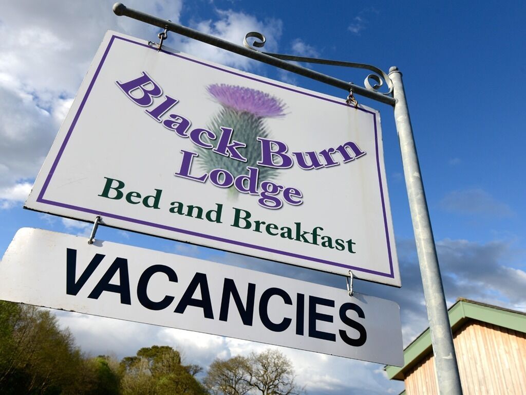 A sign for Black Burn Lodge Bed and Breakfast advertising vacancies.
