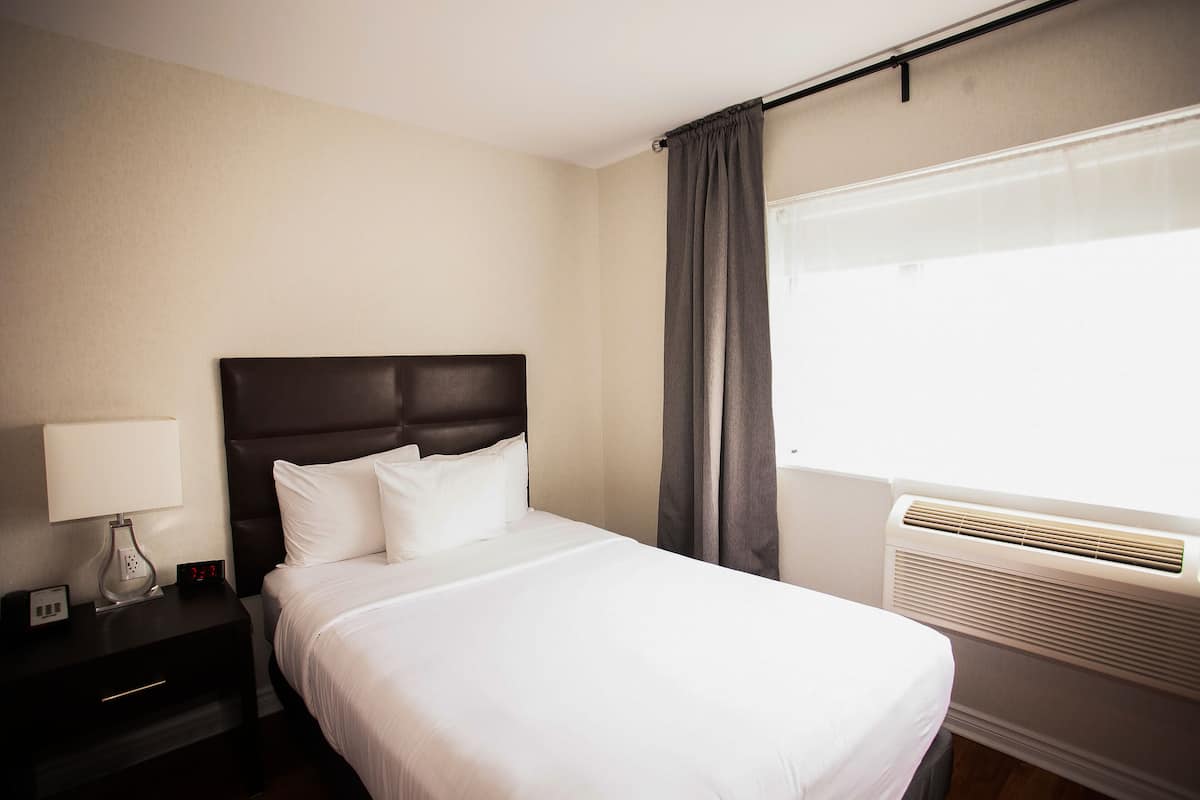 Room, Queen, Non-Smoking | Desk, blackout drapes, iron/ironing board, free WiFi