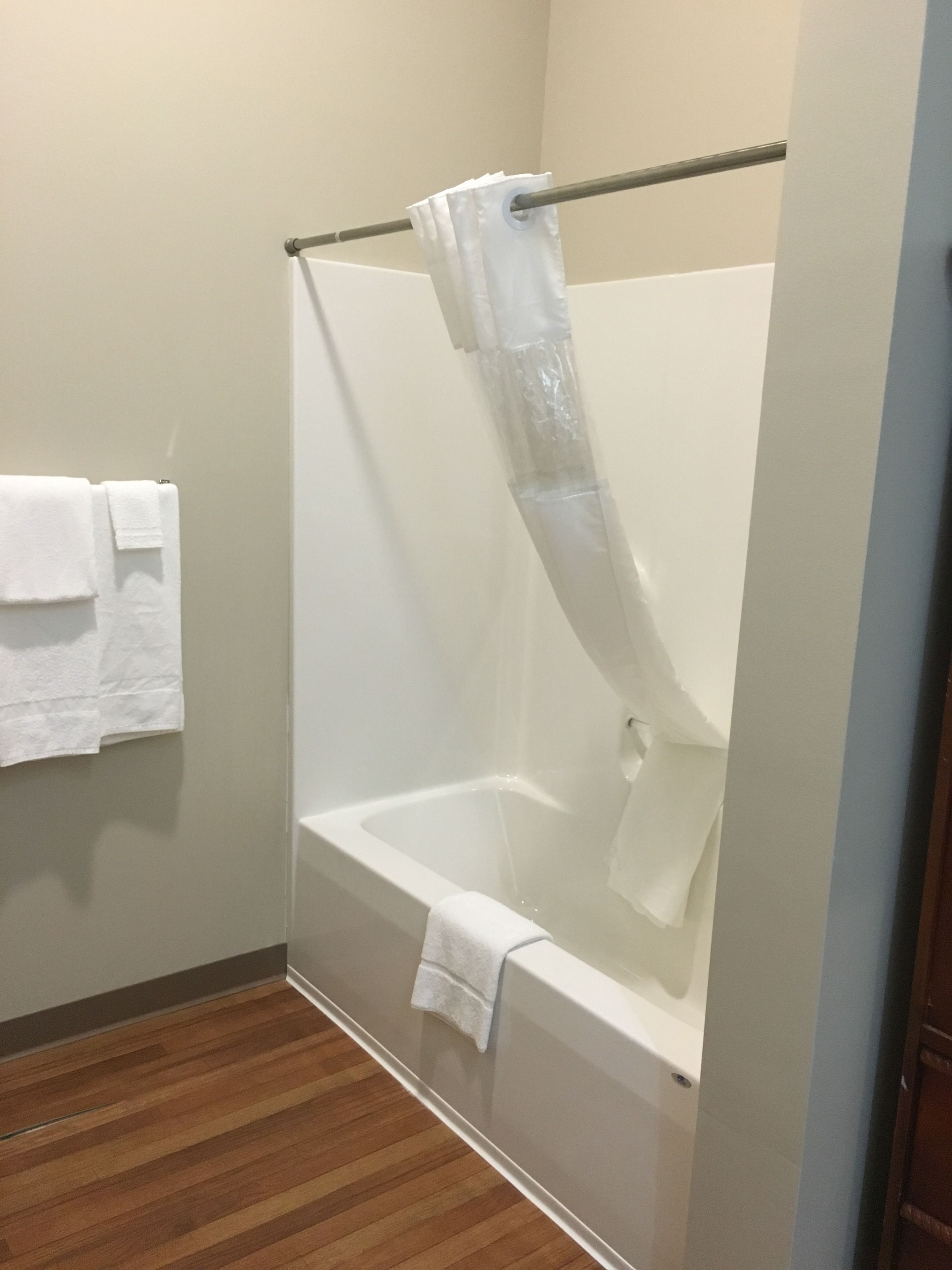 deluxe room, multiple beds, refrigerator, mountain view | bathroom | combined shower/bathtub, rainfall showerhead, free toiletries