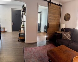 Apartment | Living area | 65-inch Smart TV with cable channels, streaming services