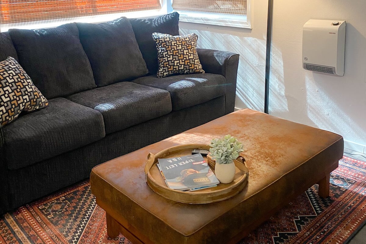 Apartment | Living area | 65-inch Smart TV with cable channels, streaming services