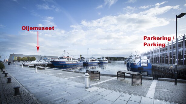 A marina with boats docked, a parking area, and a museum labeled 'Oljemuseet'. - Bjørvika Apartments - Sølvbergsgata 17 (Stavanger)