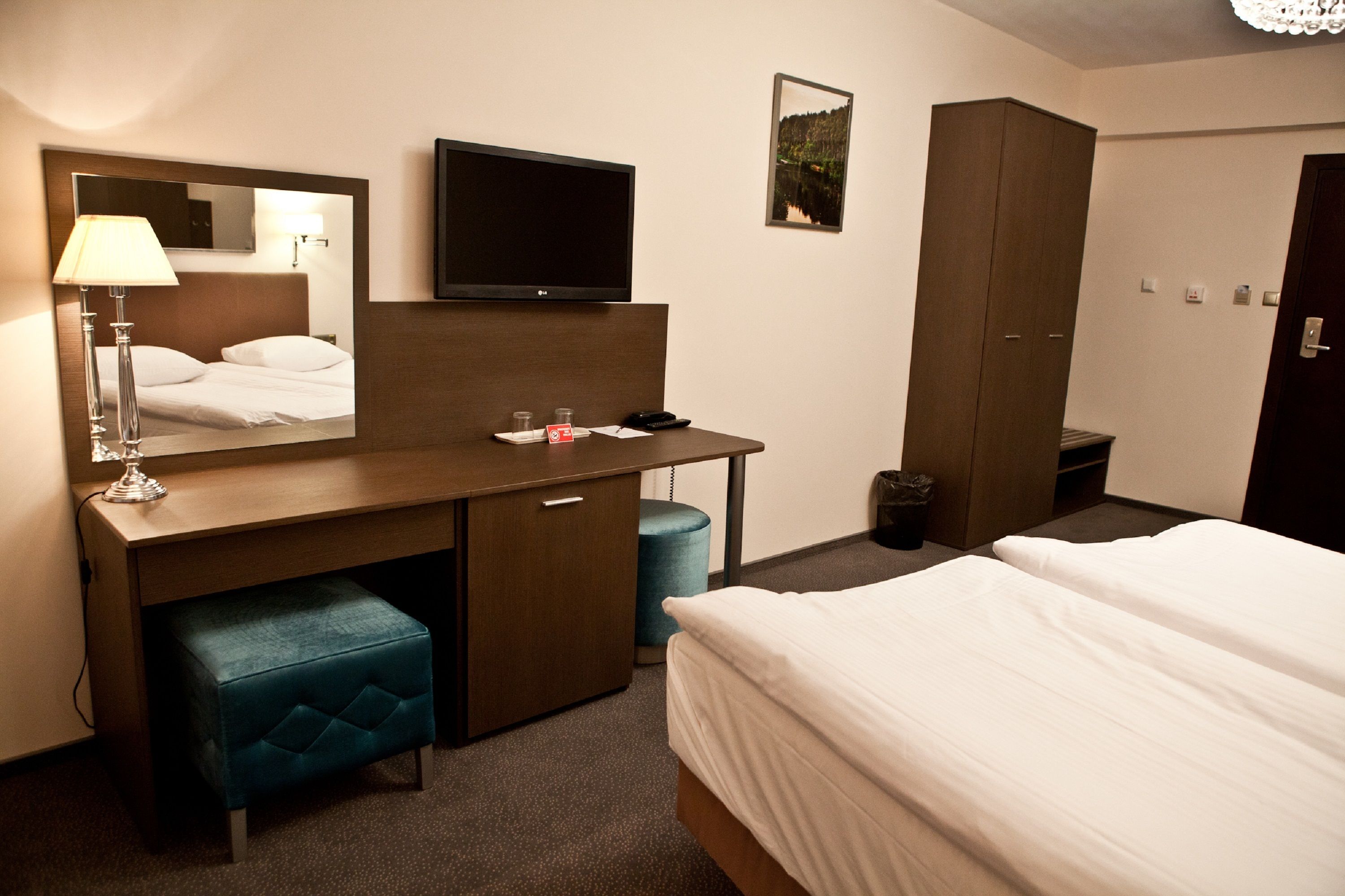 deluxe triple room | in-room safe, individually decorated, desk, laptop workspace