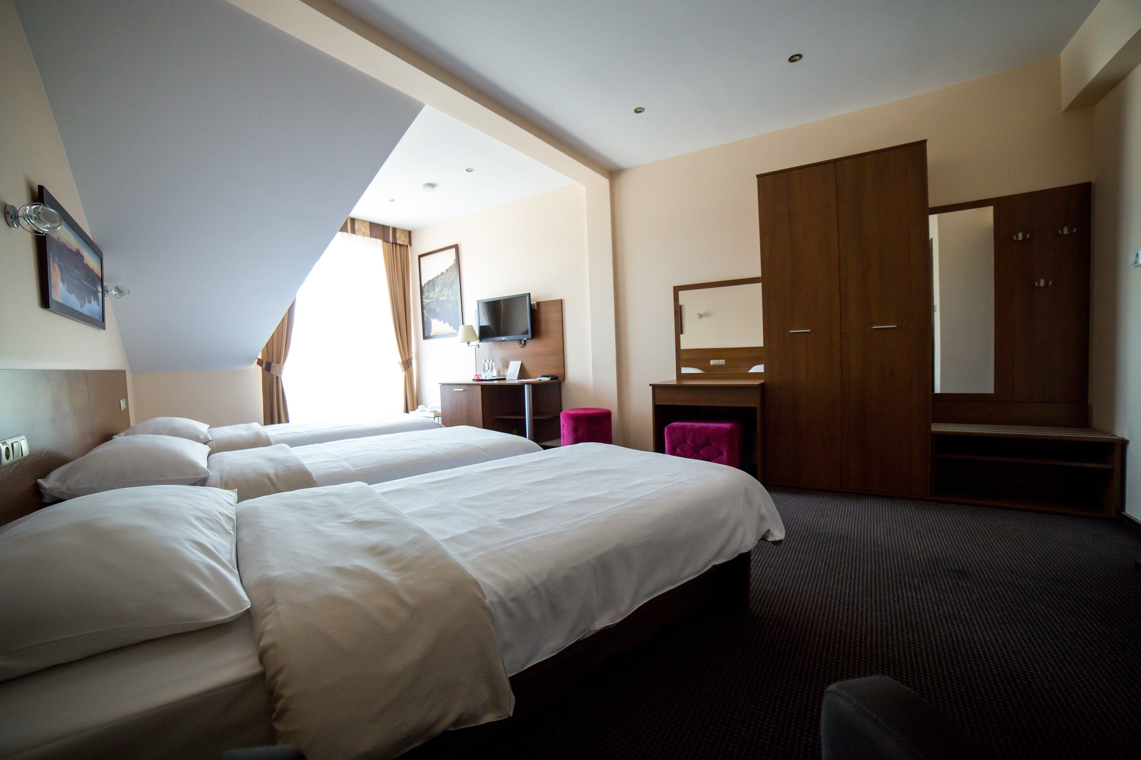 standard triple room | in-room safe, individually decorated, desk, laptop workspace