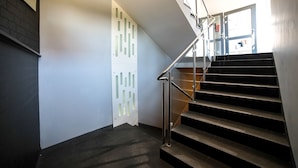 A modern staircase with metal railings and a glass door leading to a room labeled "HOTEL SOKOŁOWSKA". - Hotel Sokołowska (Nowy Dwor Mazowiecki)