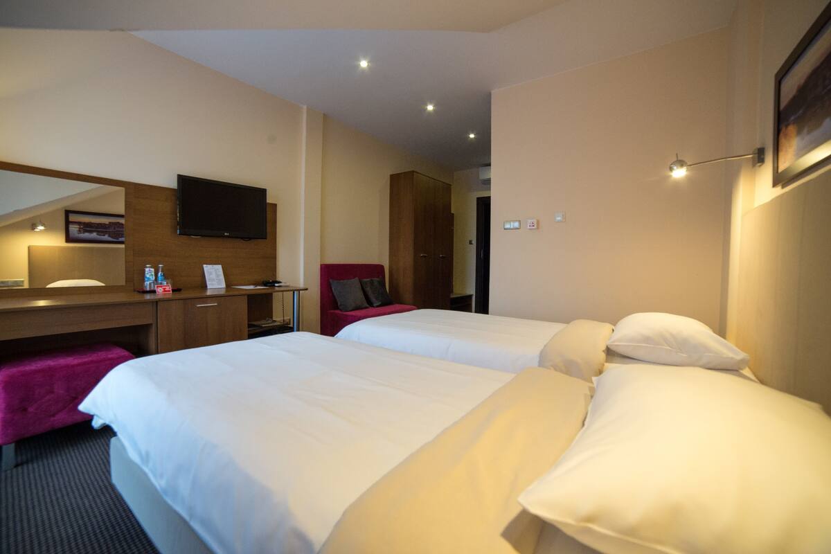 comfort twin room | in-room safe, individually decorated, desk, laptop workspace