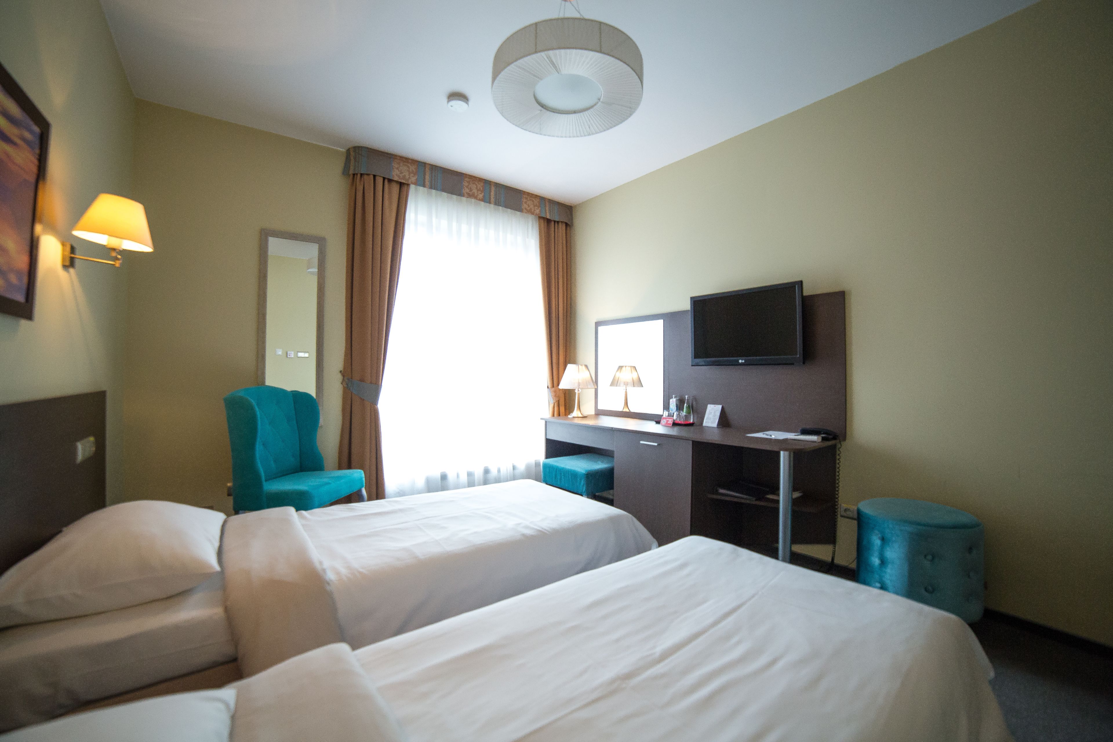 comfort twin room | in-room safe, individually decorated, desk, laptop workspace