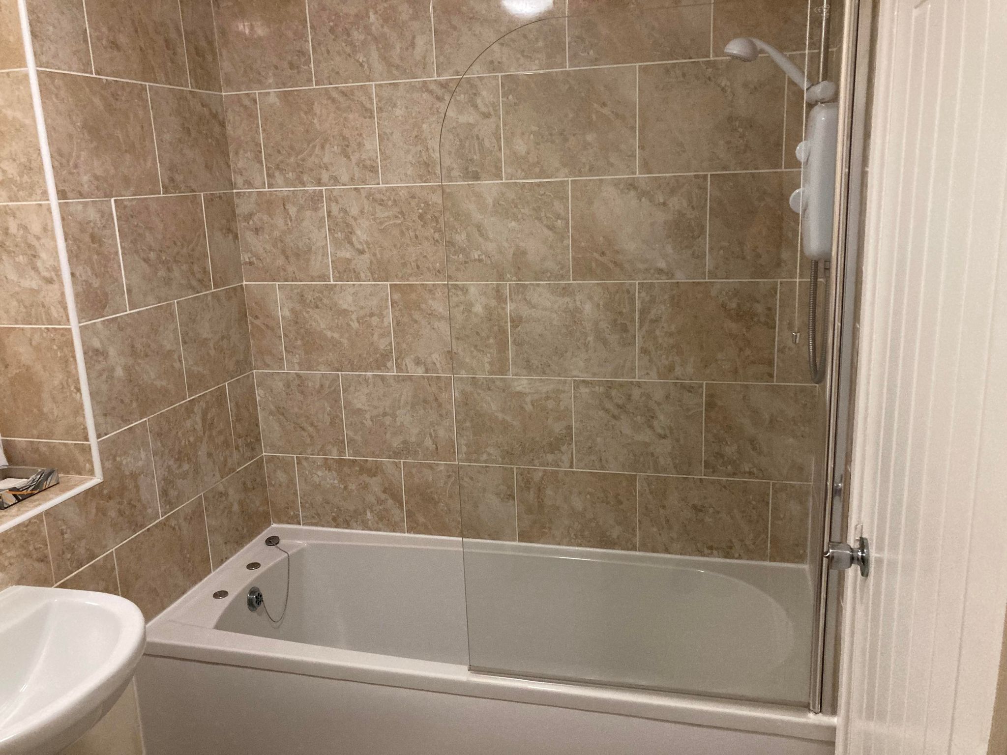A bathroom with a bathtub, a shower, and a toilet.