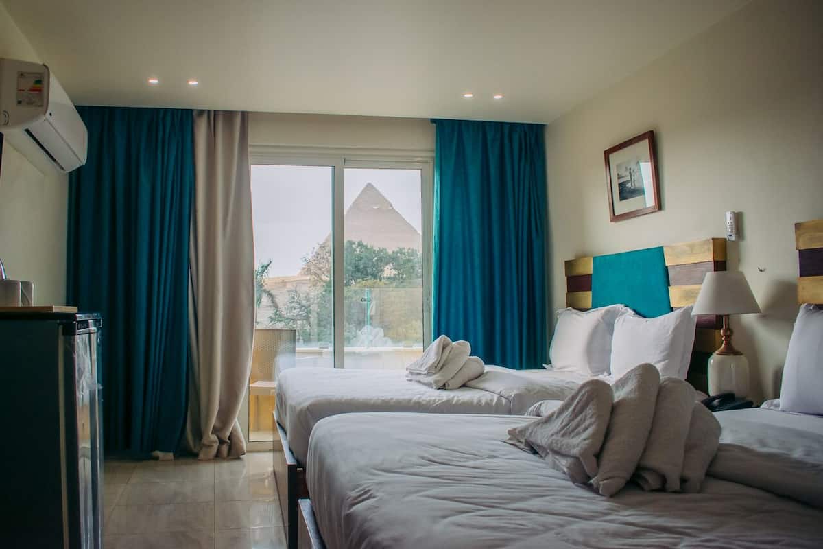 Deluxe Quadruple Room - Balcony Pyramids View | 1 bedroom, free minibar, in-room safe, blackout drapes