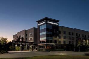 A modern hotel with a prominent sign reading "Elmore Hotel" and a covered entrance area. - The Elmore Hotel, DFW Southlake, a Tribute Portfolio Hotel (Southlake)