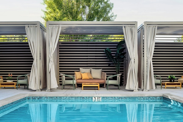 Outdoor pool, open 7:00 AM to 9:00 PM, pool loungers