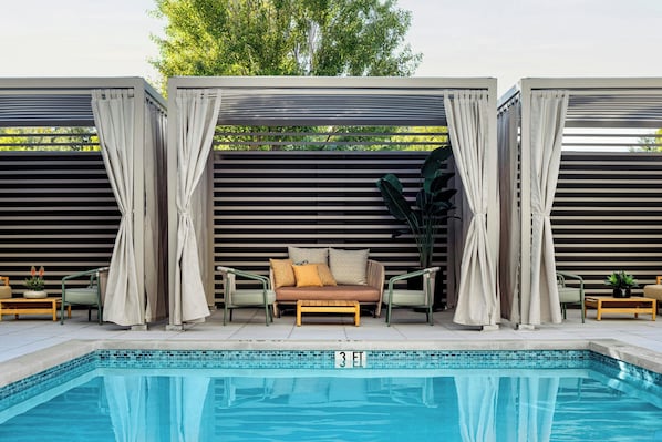 Outdoor pool, open 7:00 AM to 9:00 PM, pool loungers