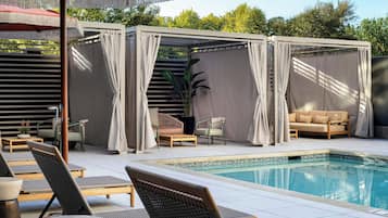 Outdoor pool, open 7:00 AM to 9:00 PM, pool loungers