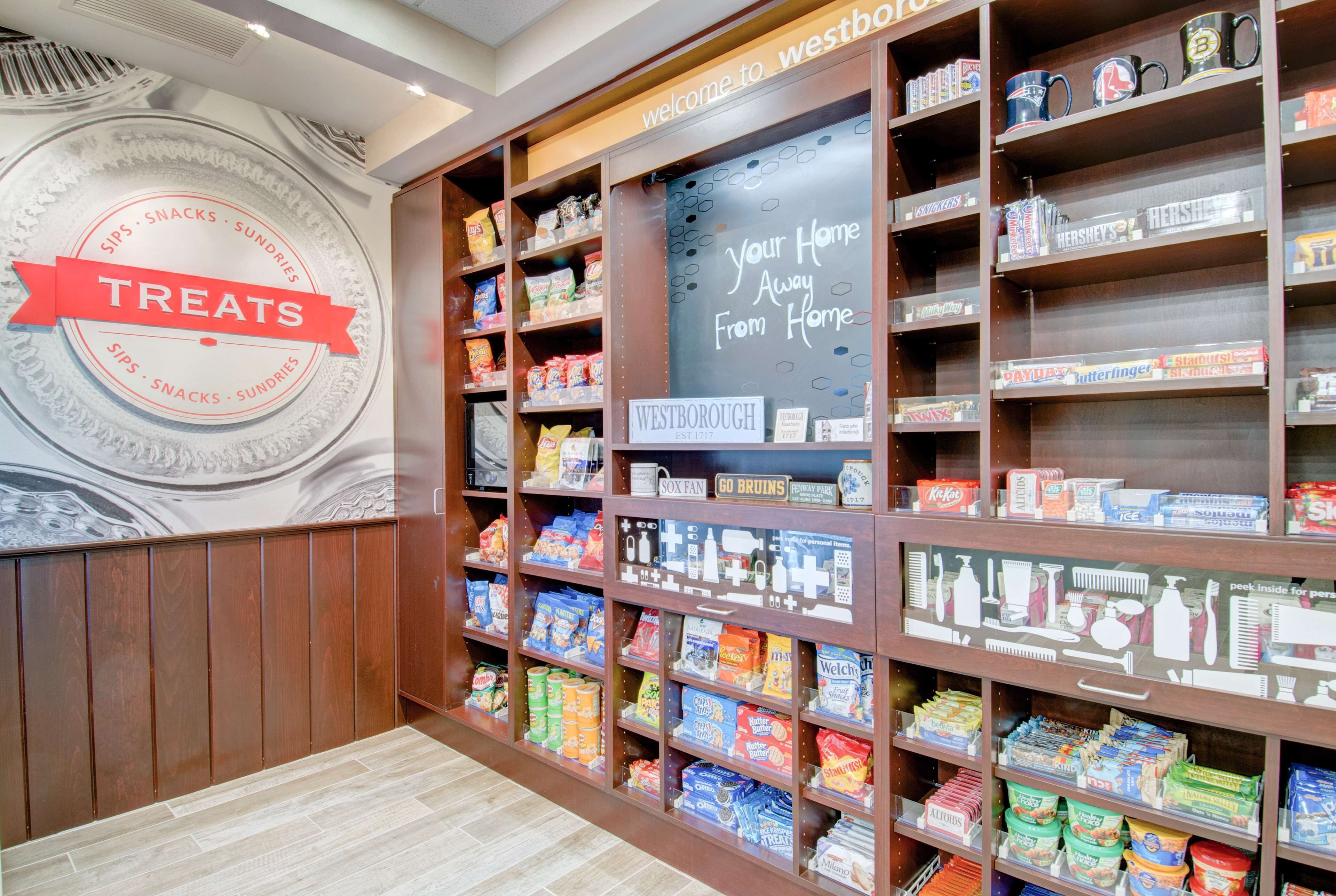 A store with shelves stocked with various snacks and treats.