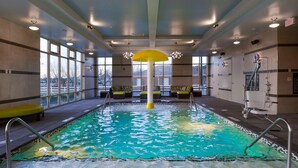 An indoor swimming pool with clear water, multiple lanes, and a central yellow structure. - Hampton Inn Lumberton (Lumberton)