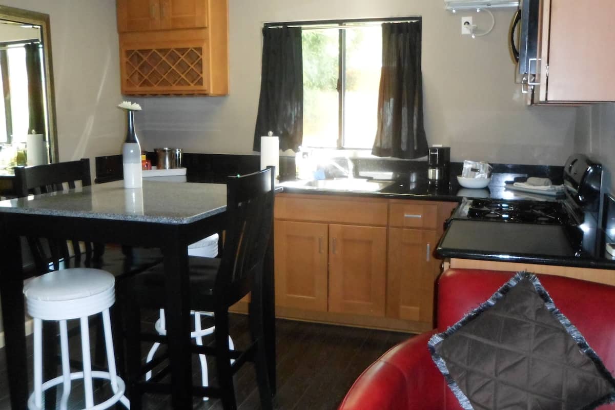 Deluxe Room, 1 King Bed, Kitchen, Pool View | Iron/ironing board, WiFi (free)