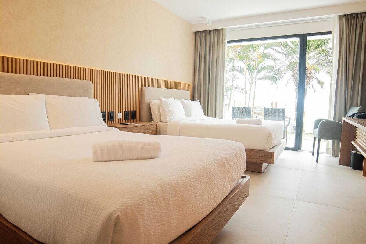 deluxe twin room, balcony, sea view | in-room safe, desk, laptop workspace, free cots/infant beds
