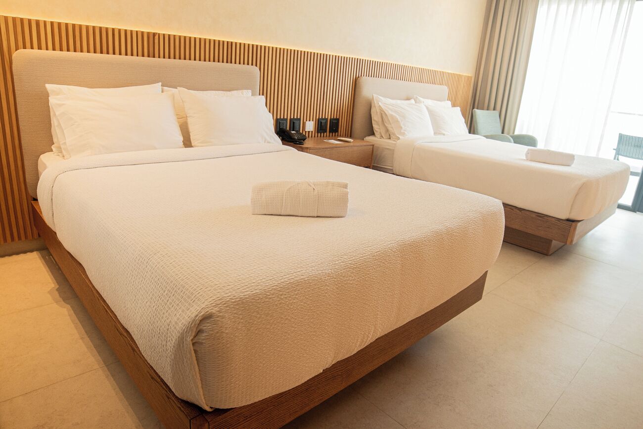 deluxe twin room, balcony, sea view | in-room safe, desk, laptop workspace, free cots/infant beds