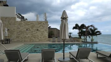 Outdoor pool, pool umbrellas, sun loungers