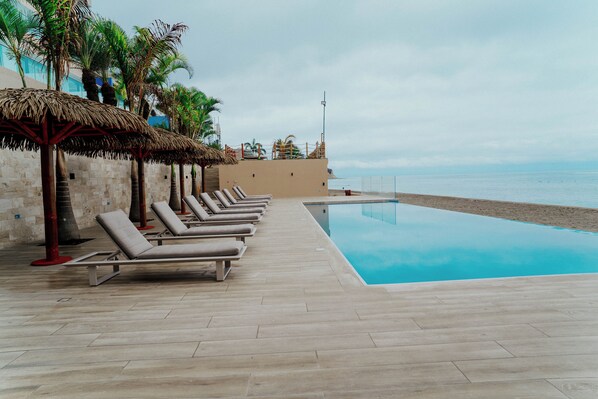Outdoor pool, pool umbrellas, sun loungers