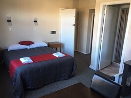 Standard Queen Room | Desk, blackout drapes, iron/ironing board, free WiFi