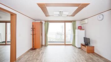 Room, 2 Bedrooms, Sea View | Living area | Flat-screen TV