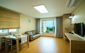 Family Room, 1 Bedroom, Kitchenette, Partial Sea View | Living area | 40-inch flat-screen TV with cable channels, TV, pay movies - Haerian Hotel (Seogwipo)