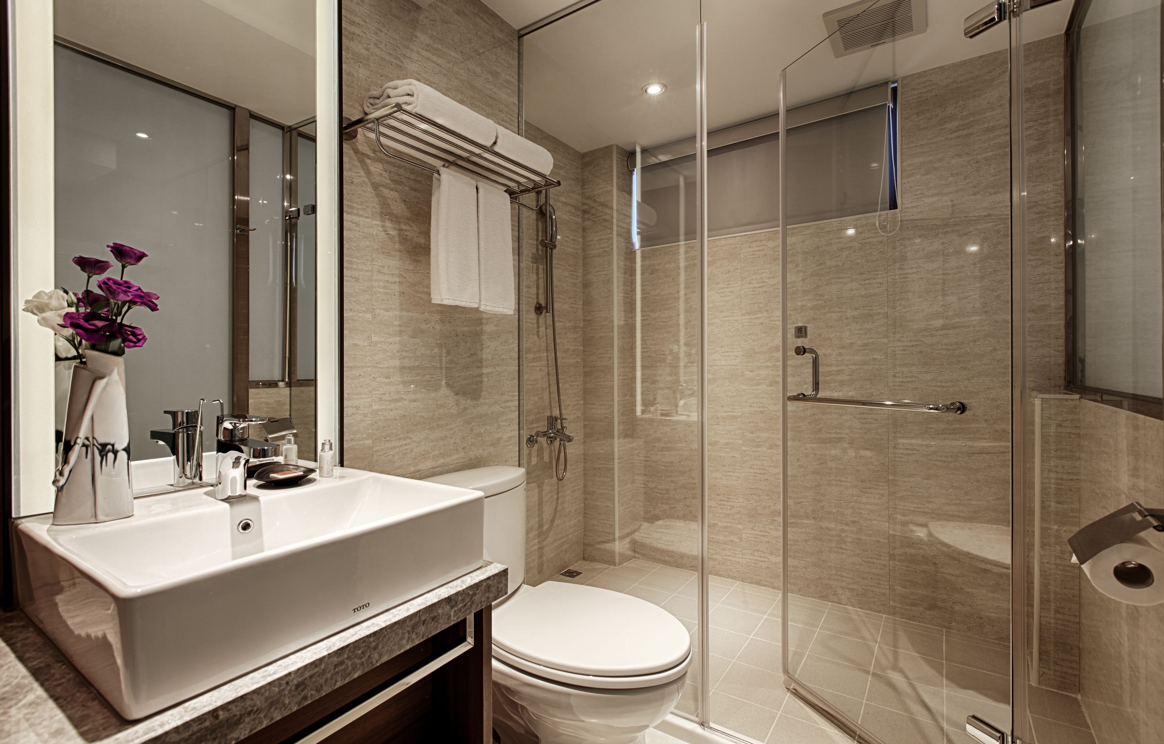 shower, hair dryer, towels, shampoo