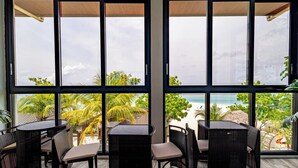 Honeymoon Room | Living area | 42-inch Smart TV with cable channels, Netflix, streaming services - Bibee Maldives (Dhiffushi)