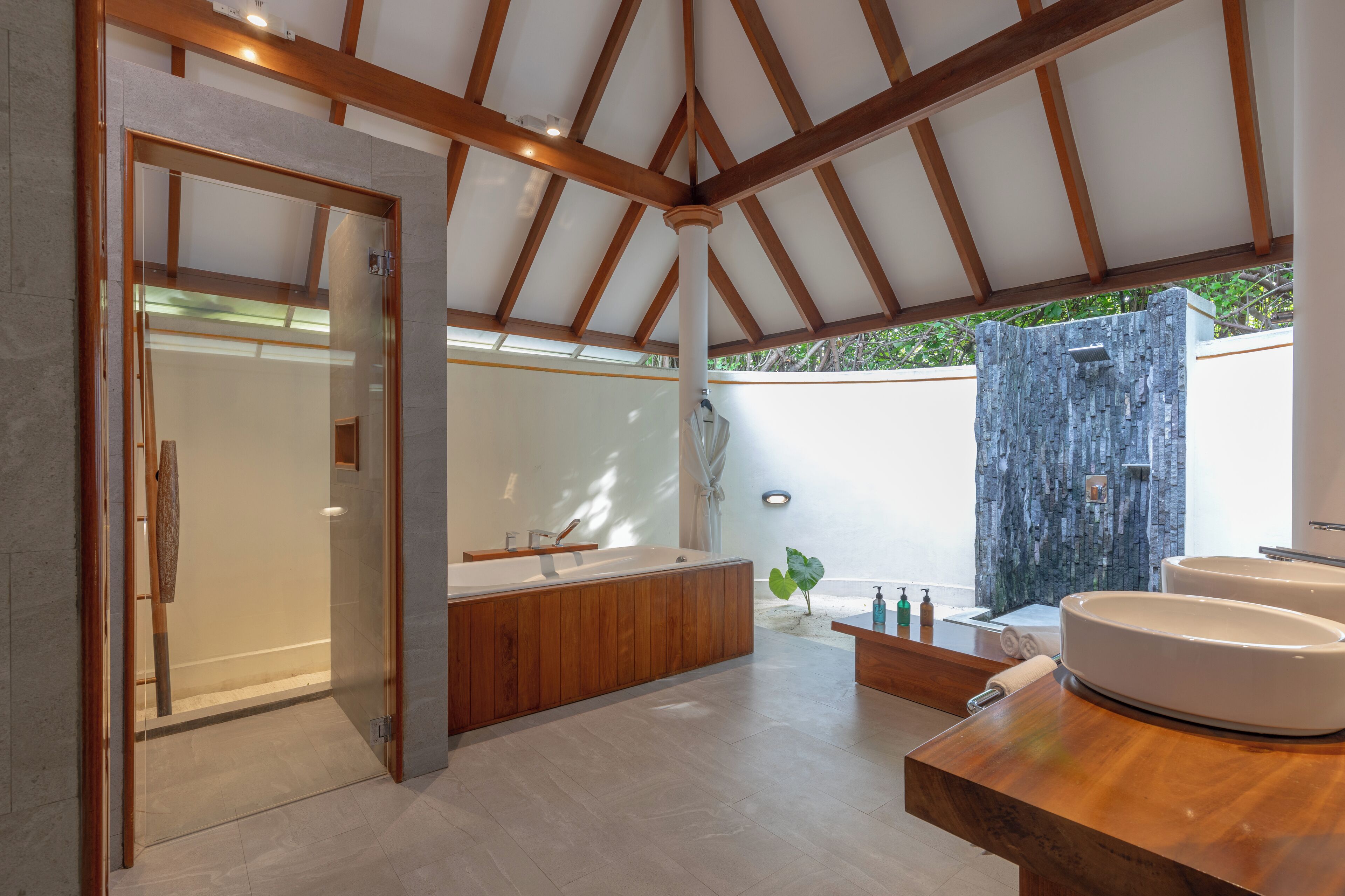 separate bathtub and shower, rainfall showerhead, designer toiletries