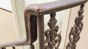 A close-up of a metal railing with intricate designs. - B&B Università (Catania)