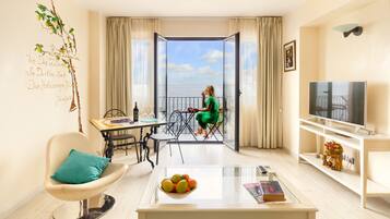 Superior Suite, Sea View | Living room | LCD TV