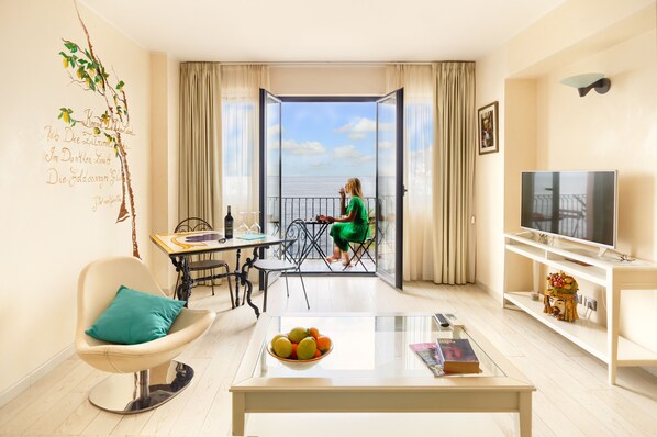 Superior Suite, Sea View | Living room | LCD TV