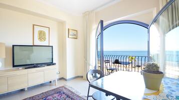 Superior Suite, Sea View | Living room | LCD TV