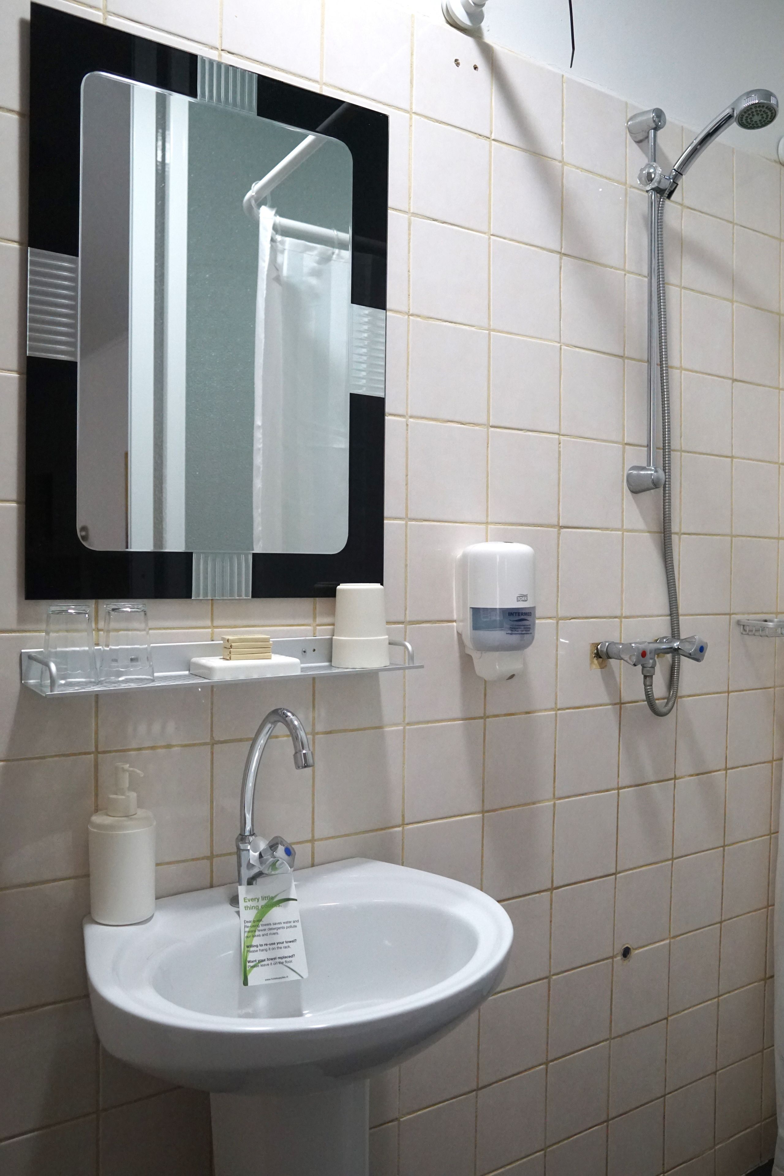 family room, city view | bathroom | shower, free toiletries, hair dryer, towels
