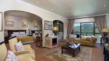 Luxury Suite, 2 Queen Beds, Private Bathroom, Valley View | Living area | 42-inch flat-screen TV with satellite channels, TV, DVD player