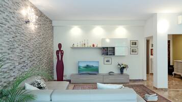 Superior Apartment, 3 Bedrooms | Living room | 26-inch TV with digital channels