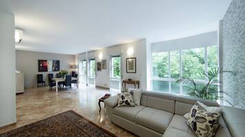 Superior Apartment, 3 Bedrooms | Living room | 26-inch TV with digital channels