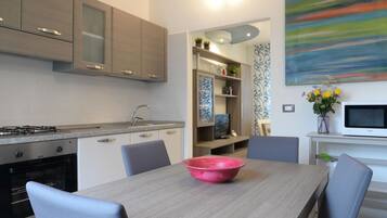 Deluxe Apartment, 2 Bedrooms | Private kitchen | Full-size fridge, microwave, oven, stovetop