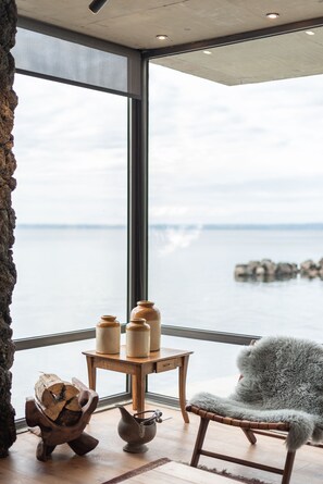 Family Villa | Living area | Flat-screen TV, MP3 dock - Hotel AWA Puerto Varas (Puerto Varas)